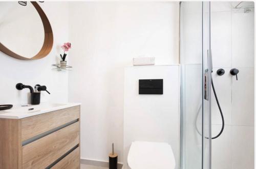 a bathroom with a shower and a toilet and a sink at Las Arenas in Costa Calma