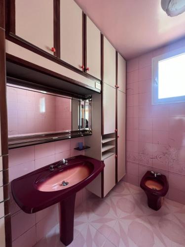 a bathroom with a sink and a toilet at Villa Horizon & Pool Bizerte in Bizerte