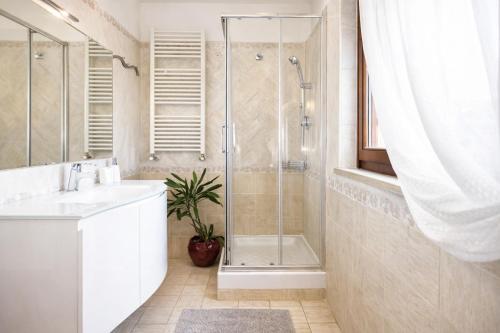 a bathroom with a shower and a sink and a toilet at Casa di Rita in Morlupo