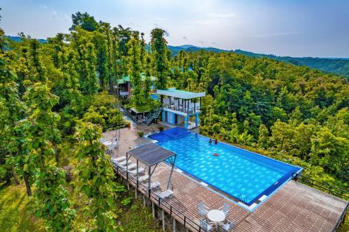 an aerial view of a house with a swimming pool at Green Peak Resorts in Baitarāni