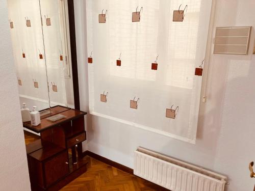 a bathroom with a window with cards on the wall at La Florida 43 in Soria