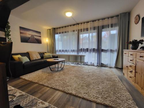a living room with a couch and a table at Ferienwohnung Schäfer in Siegsdorf
