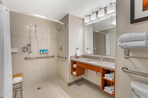 a bathroom with a sink and a shower at Drury Inn & Suites Fort Myers Airport FGCU in Fort Myers