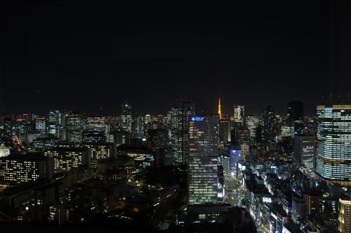 a city at night with skyscrapers at The Prince Gallery Tokyo Kioicho, a Luxury Collection Hotel in Tokyo