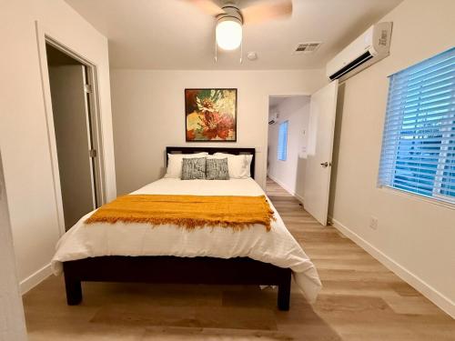 a bedroom with a bed and a large window at Azure Casita in Tempe