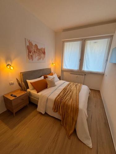 a bedroom with a large bed and a window at Lo Spaho Suite Florence in Florence