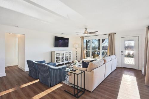 a living room with a couch and two chairs at Lake Granbury House, Sleeps 11 with Lake Access! in Granbury
