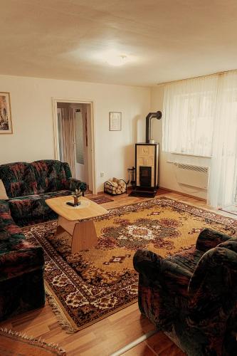a living room with a couch and a coffee table at Berlin Home by RentALL in Gheorgheni