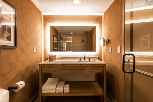 a bathroom with a sink and a mirror at Eldorado Hotel and Spa in Santa Fe