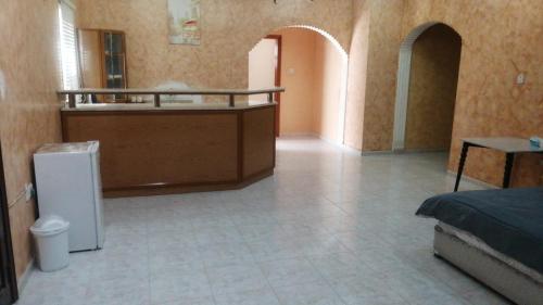 a room with a room with a counter and a room with at House Estrella - 11 in Al Ain