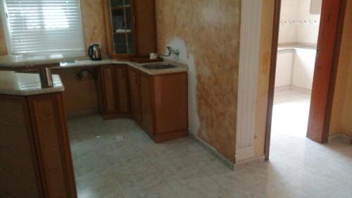 a kitchen with a sink and a counter top at House Estrella - 11 in Al Ain