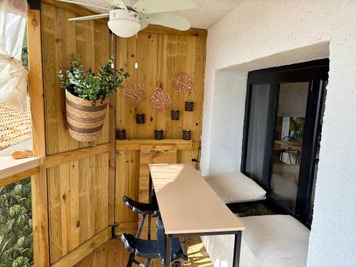 a room with a table and chairs and a ceiling at Casa Halcón in Jávea
