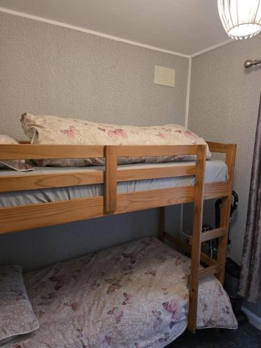a bedroom with two bunk beds in a room at Pet friendly sleeps 6 Chalet Bridlington free elec in Bridlington