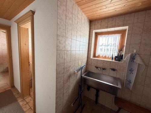 a bathroom with a sink and a window at  