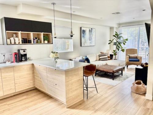 a kitchen and a living room with a couch at New Luxe 3B 3Bath Townhouse in Sherman Oaks