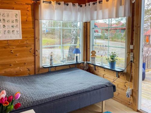 a bedroom with a bed in a room with a window at 4 person holiday home in SÖDERKÖPING in Söderköping