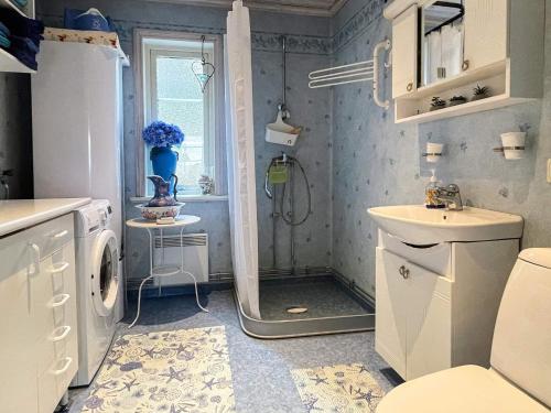 a bathroom with a shower and a toilet and a sink at 4 person holiday home in SÖDERKÖPING in Söderköping