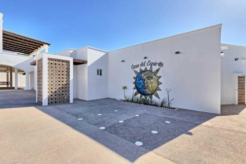 a white building with a mural on the side of it at Luxury & Spacious Beachfront Home Casa Espiritu in Puerto Peñasco