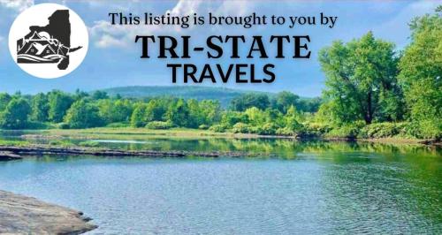 a picture of a river with the words this listing is brought to you by tr at Chic Chalet River Views & Access in Montague