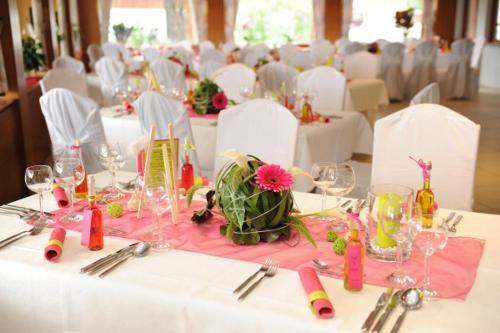 a table with a white table cloth with a flower on it at Waldschenke Fuhr in Heppenheim an der Bergstrasse