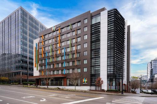 a tall building on a city street with a road at EVEN Hotel Seattle Downtown - Lake Union by IHG in Seattle