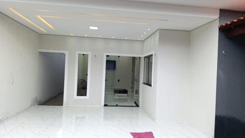 a hallway with white walls and a ceiling at SSP Ubajara in Ubajara