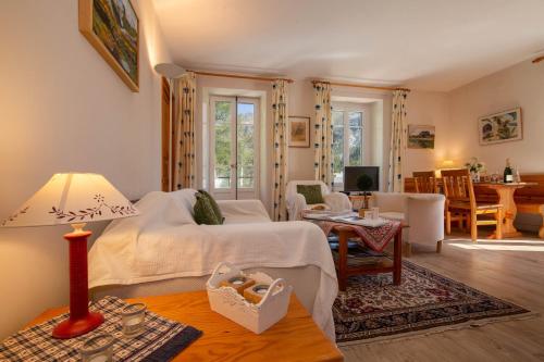 a bedroom with a bed and a living room at Résidence Bel'Alp in Chamonix