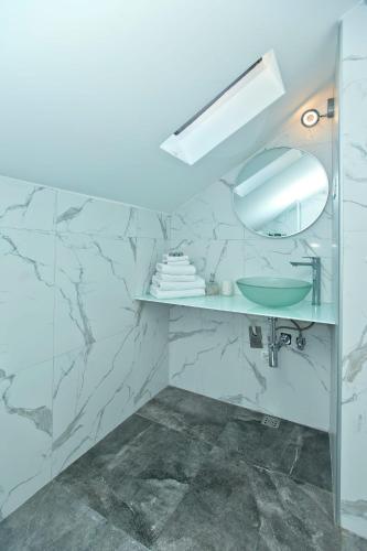 a bathroom with a sink and a mirror at Core of Hvar Old Town in Hvar