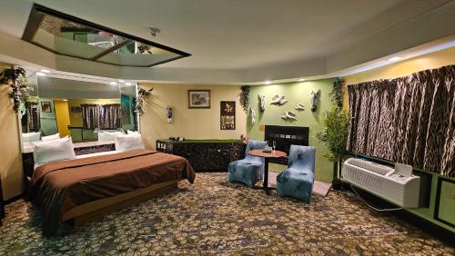 a hotel room with a bed and a fireplace at Inn of the Dove Harrisburg-Hershey Romantic Suites in Harrisburg