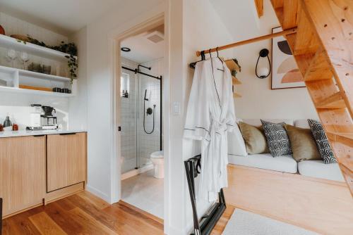 a living room with a couch and a bathroom at Camp Alta in Packwood