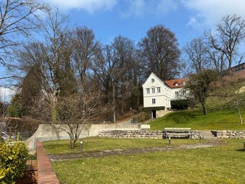 a white house sitting on top of a hill at Gabi`s Villa am Hang in Bad Aibling