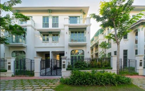 a large white building with a fence in front of it at Opus Villas Tropical Phu Quoc in Phú Quốc