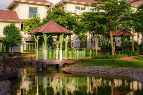 a gazebo in the water in front of a house at Opus Villas Tropical Phu Quoc in Phú Quốc