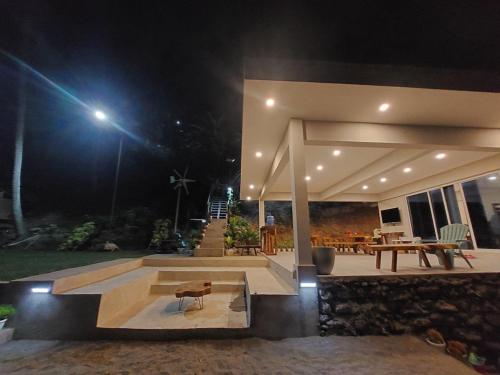 a house with a patio at night at Costa Moriah Manticao PH in Manticao