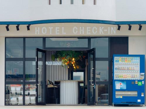 a hotel check in sign in front of a building at メーアレジデンスホテル 宮古空港前 - Meer Residence Hotel Miyako Airport - in Miyako-jima