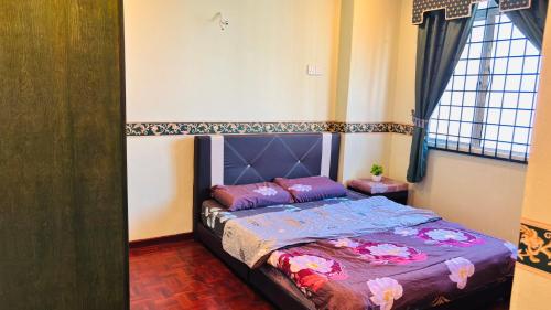 a bedroom with a bed in a room at Glory Beach Resort By D'Shepherd Management in Port Dickson