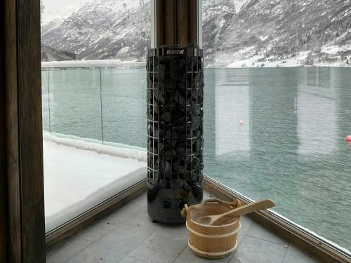 a window with a view of a snow covered mountain at Newly Built Cabin With Sauna By Oldevatnet in Olden