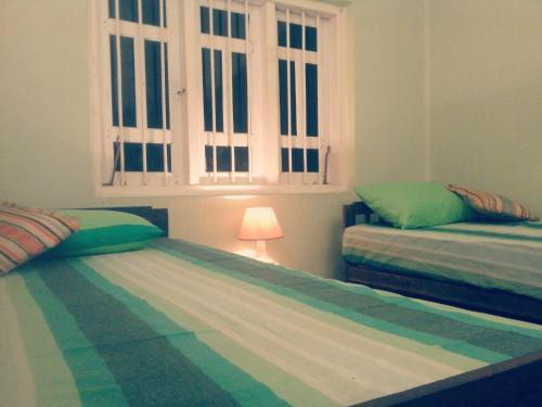 Postel nebo postele na pokoji v ubytování Cozy Cottage-Tangalle