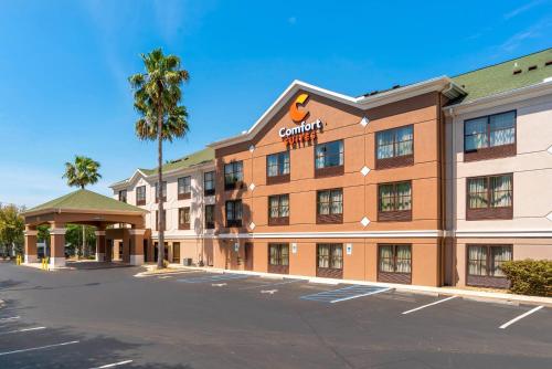 a rendering of a hotel with a parking lot at Comfort Suites Tallahassee Capitol - University Area in Tallahassee