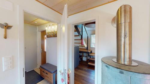 a home with a staircase and a house with a wine barrel at Mauritius MR1 in Naters