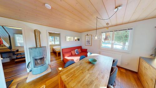 a living room with a couch and a fireplace at Mauritius MR1 in Naters