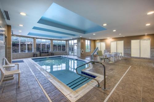 a swimming pool in a house with a ceiling at Hilton Garden Inn Durham Southpoint in Durham