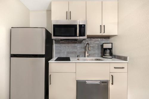 a kitchen with a sink and a refrigerator at Bluegreen Vacations Club 36, an Ascend Collection Resort in Las Vegas