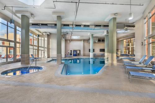 an indoor pool in a large building with lounge chairs at Bluegreen Vacations Club 36, an Ascend Collection Resort in Las Vegas