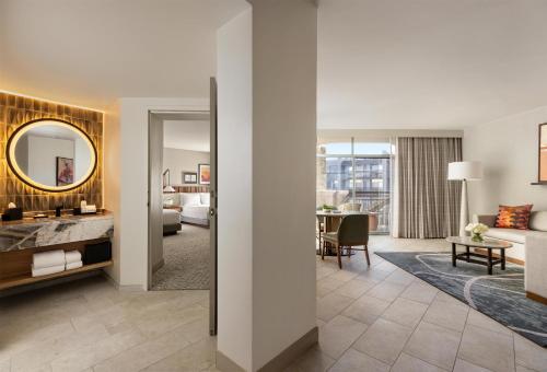 a rendering of a hotel room with a living room at Grand Hyatt Scottsdale Resort in Scottsdale