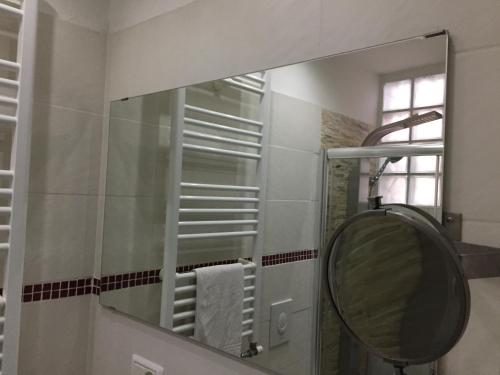 a bathroom with a mirror and a shower at Hotel Viking in Rimini