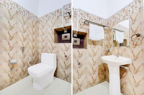 a bathroom with a toilet and a sink at Hotel O Tehsil Chowk Doon Hospital Formerly Hotel Comfort in Dehradun