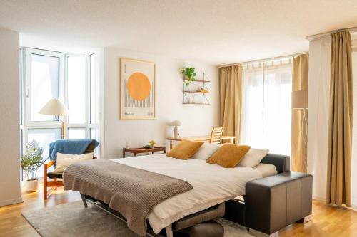a bedroom with a large bed in a room at Central12 Apartment - Free Parking in Thun