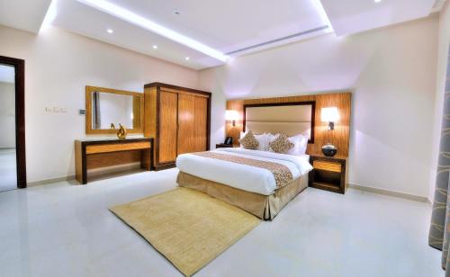 Ένα ή περισσότερα κρεβάτια σε δωμάτιο στο Auris Al Fanar Suites