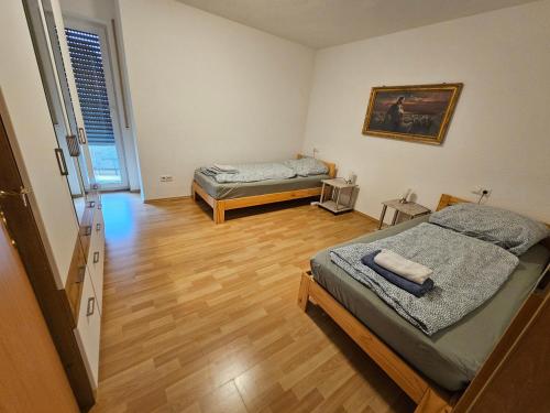 a bedroom with two beds in a room at Stadtperle in Göppingen